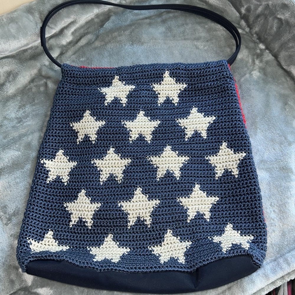 Women’s navy, white, & red star patterned 
patriotic crocheted bag.